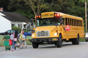 Hallie boards her bus on the first day of school