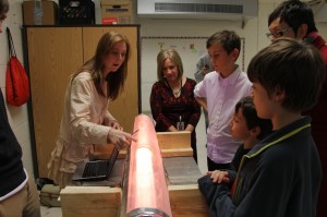 An N.C. State student demonstrates a plasma tube at Conn Elementary